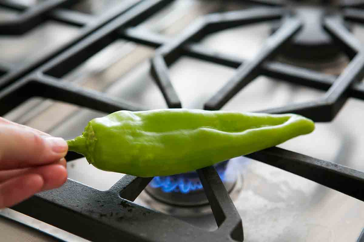 raw green chile on gas flame